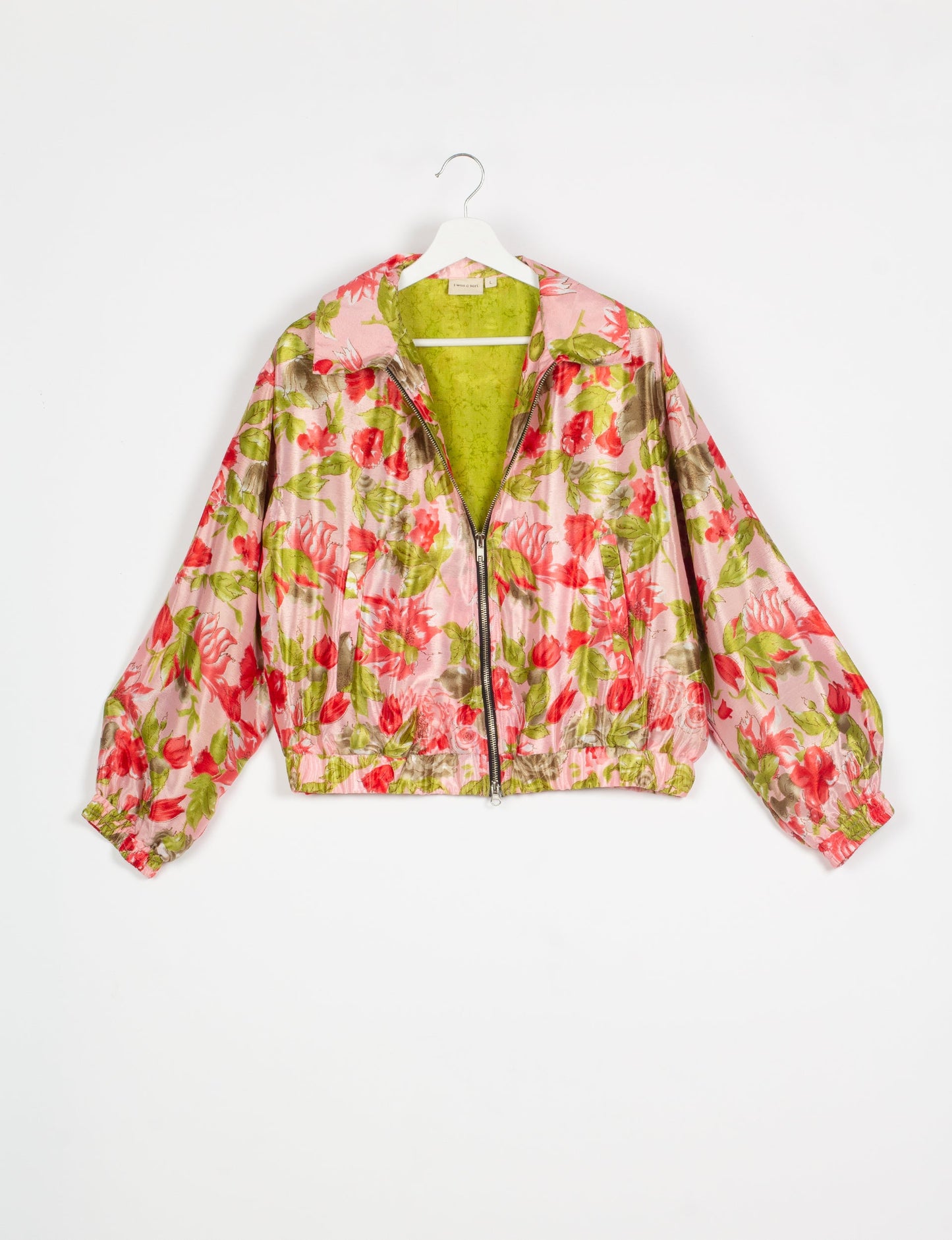 Stylish BOMBER JACKET, an upcycled clothing masterpiece with a cute cropped shape, elasticated details, and detachable metallic zipper. Contrast sari print lining adds a unique touch. Explore sustainable and eco-friendly fashion.