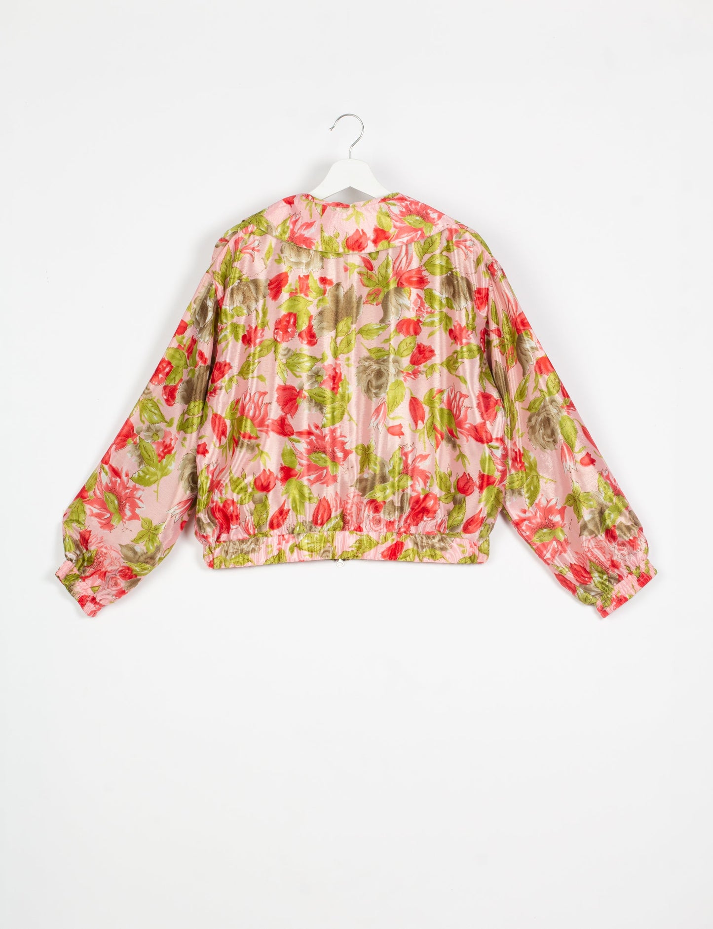 Stylish BOMBER JACKET, an upcycled clothing masterpiece with a cute cropped shape, elasticated details, and detachable metallic zipper. Contrast sari print lining adds a unique touch. Explore sustainable and eco-friendly fashion.