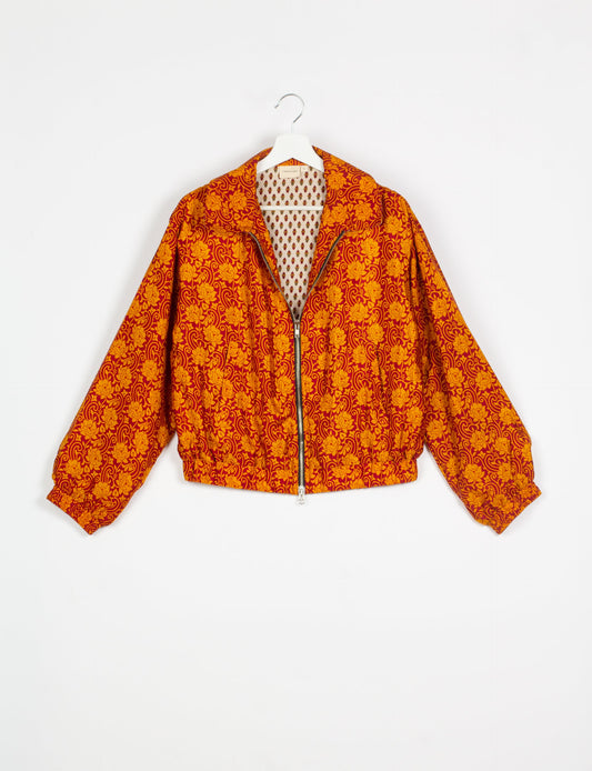 Stylish BOMBER JACKET, an upcycled clothing masterpiece with a cute cropped shape, elasticated details, and detachable metallic zipper. Contrast sari print lining adds a unique touch. Explore sustainable and eco-friendly fashion.