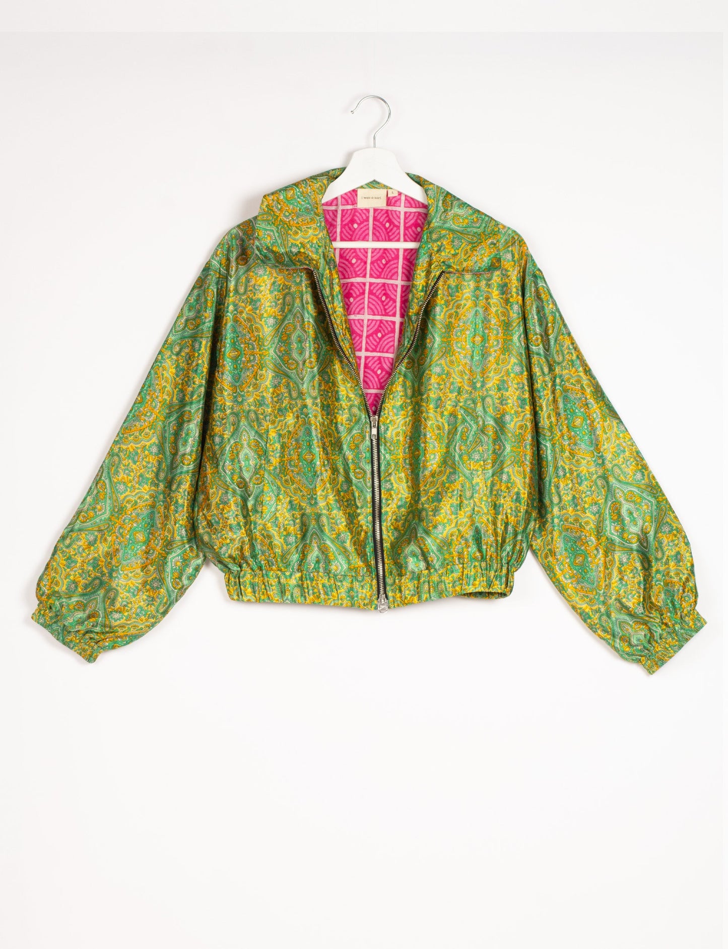 Stylish BOMBER JACKET, an upcycled clothing masterpiece with a cute cropped shape, elasticated details, and detachable metallic zipper. Contrast sari print lining adds a unique touch. Explore sustainable and eco-friendly fashion.