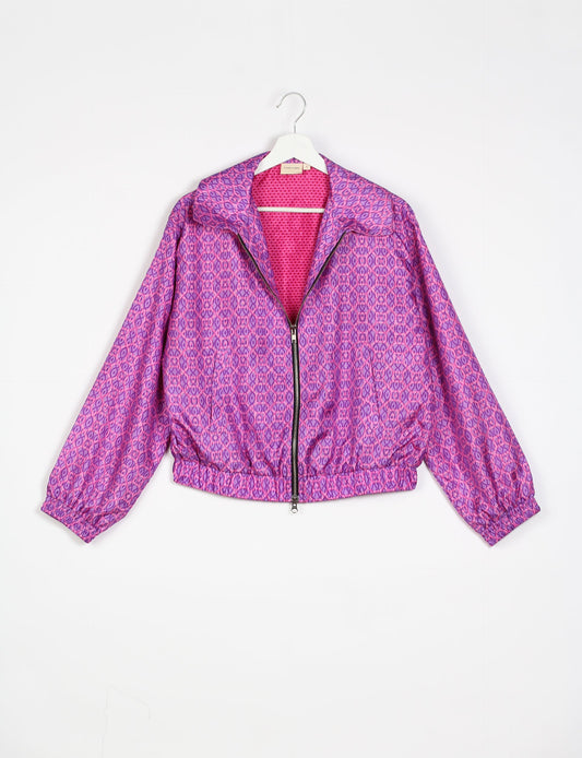 Stylish BOMBER JACKET, an upcycled clothing masterpiece with a cute cropped shape, elasticated details, and detachable metallic zipper. Contrast sari print lining adds a unique touch. Explore sustainable and eco-friendly fashion.