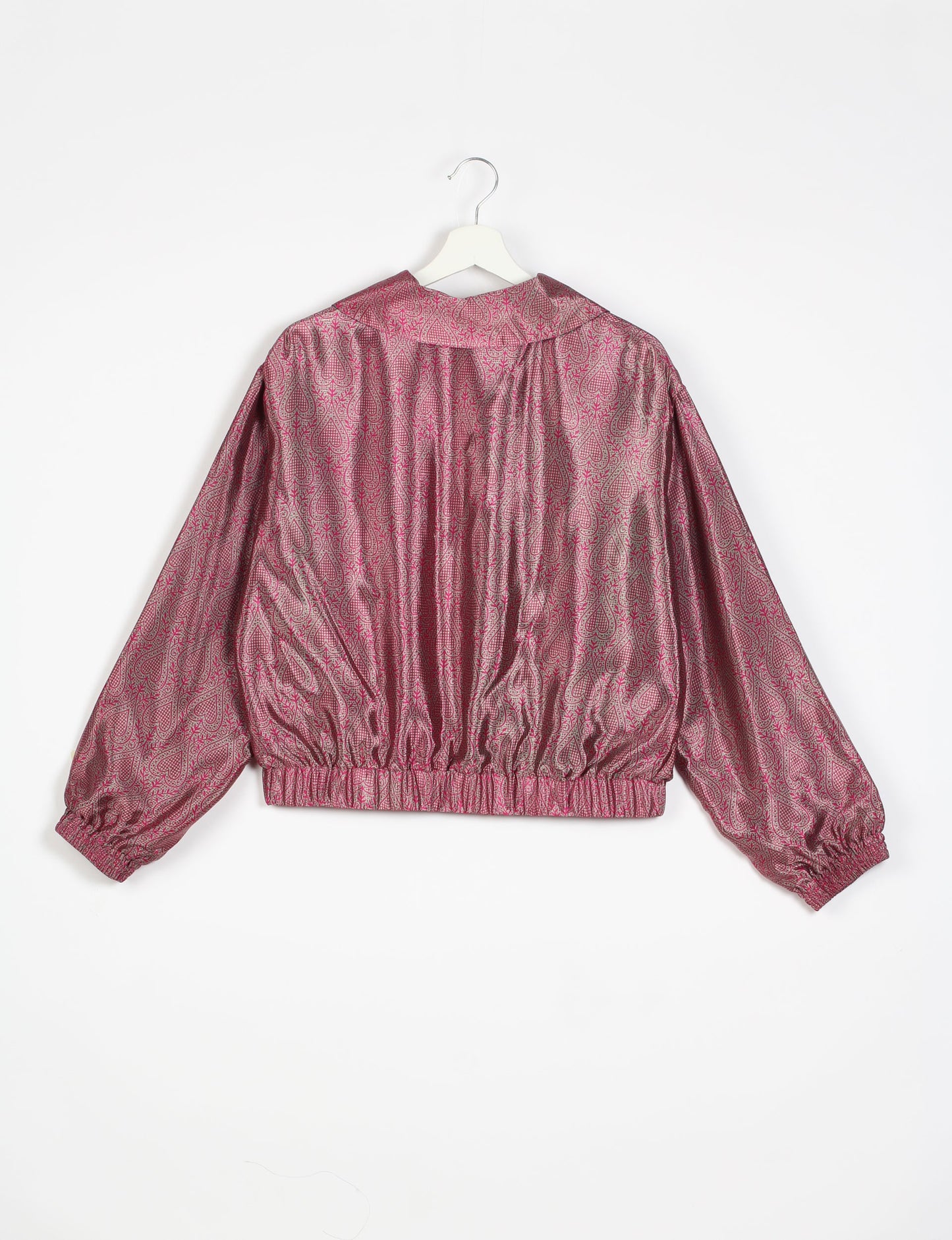 Stylish BOMBER JACKET, an upcycled clothing masterpiece with a cute cropped shape, elasticated details, and detachable metallic zipper. Contrast sari print lining adds a unique touch. Explore sustainable and eco-friendly fashion.