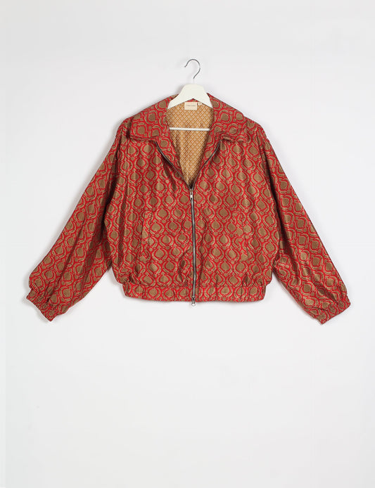 Stylish BOMBER JACKET, an upcycled clothing masterpiece with a cute cropped shape, elasticated details, and detachable metallic zipper. Contrast sari print lining adds a unique touch. Explore sustainable and eco-friendly fashion.