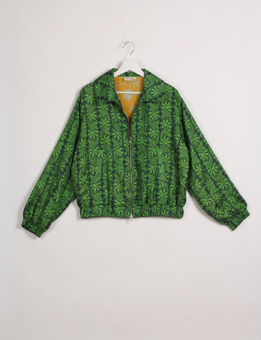 Stylish BOMBER JACKET, an upcycled clothing masterpiece with a cute cropped shape, elasticated details, and detachable metallic zipper. Contrast sari print lining adds a unique touch. Explore sustainable and eco-friendly fashion.