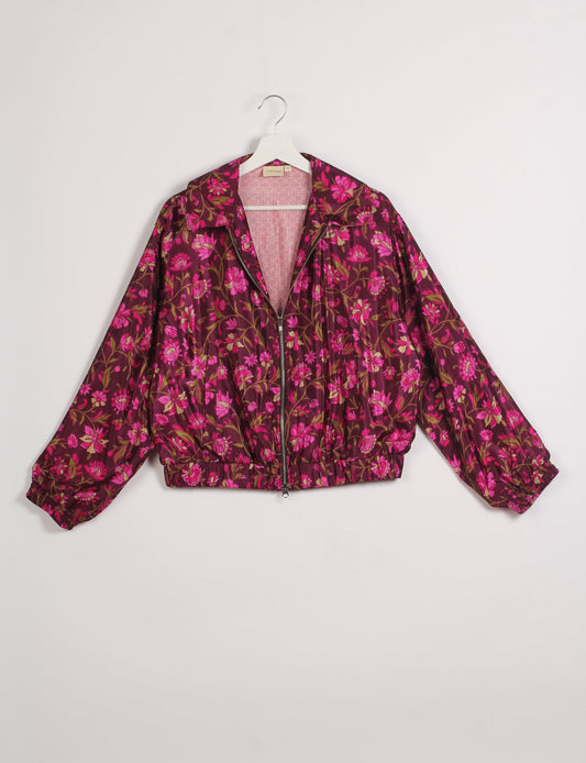 Stylish BOMBER JACKET, an upcycled clothing masterpiece with a cute cropped shape, elasticated details, and detachable metallic zipper. Contrast sari print lining adds a unique touch. Explore sustainable and eco-friendly fashion.