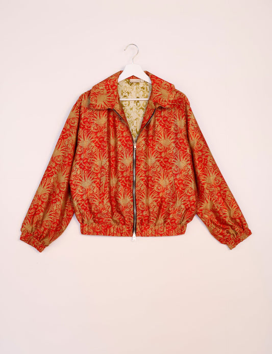 Stylish BOMBER JACKET, an upcycled clothing masterpiece with a cute cropped shape, elasticated details, and detachable metallic zipper. Contrast sari print lining adds a unique touch. Explore sustainable and eco-friendly fashion.