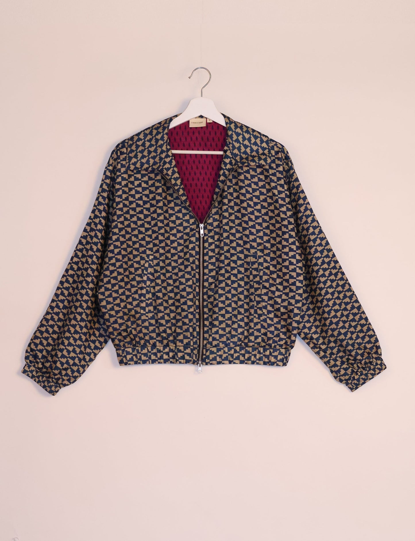 Stylish BOMBER JACKET, an upcycled clothing masterpiece with a cute cropped shape, elasticated details, and detachable metallic zipper. Contrast sari print lining adds a unique touch. Explore sustainable and eco-friendly fashion.