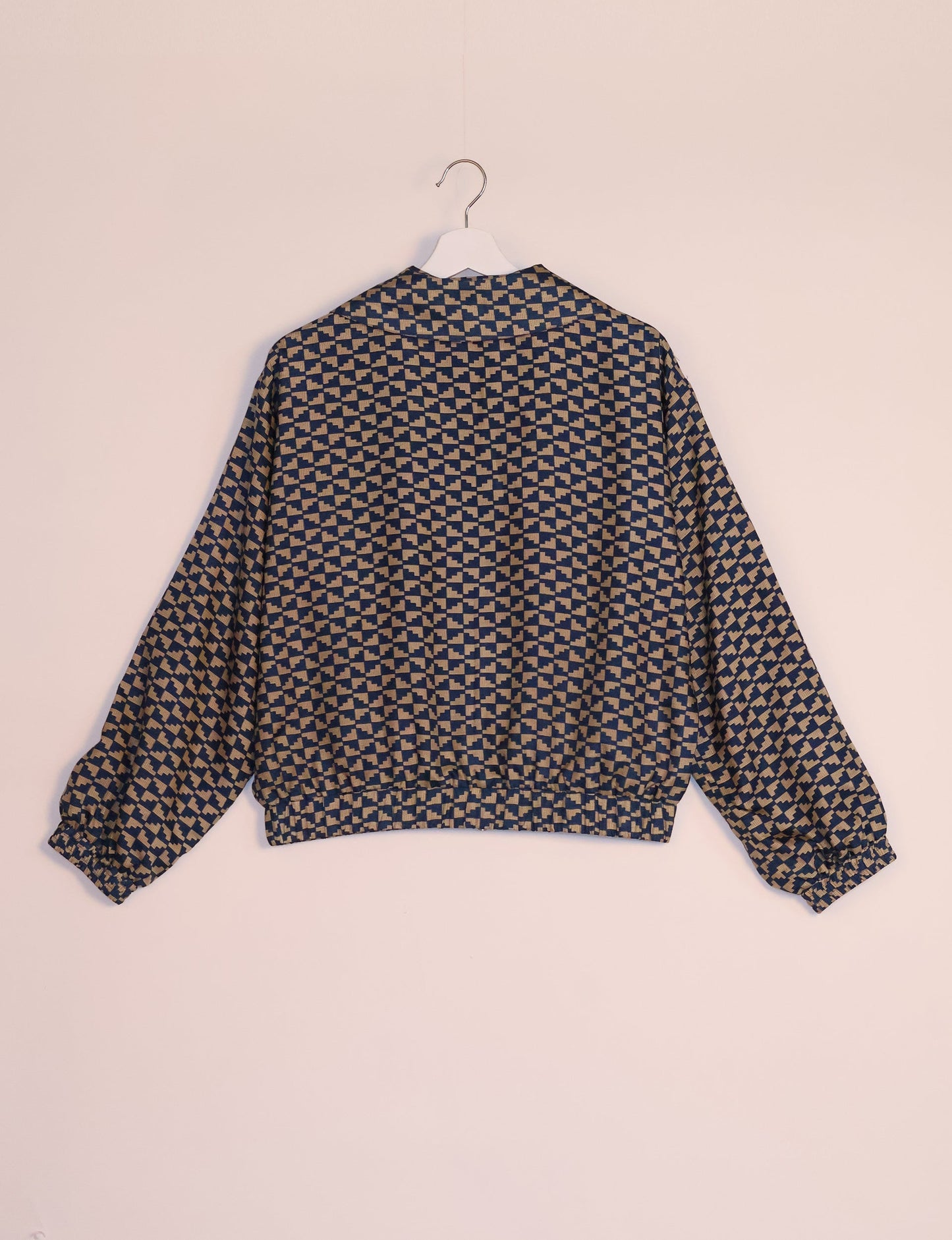 Stylish BOMBER JACKET, an upcycled clothing masterpiece with a cute cropped shape, elasticated details, and detachable metallic zipper. Contrast sari print lining adds a unique touch. Explore sustainable and eco-friendly fashion.