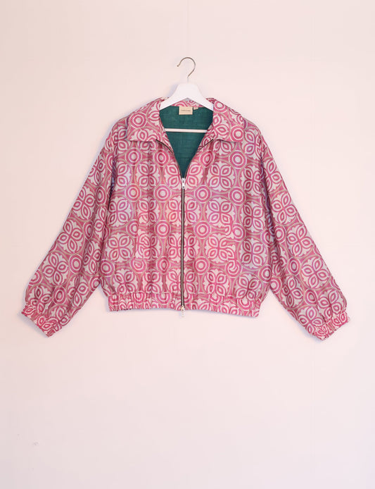 Stylish BOMBER JACKET, an upcycled clothing masterpiece with a cute cropped shape, elasticated details, and detachable metallic zipper. Contrast sari print lining adds a unique touch. Explore sustainable and eco-friendly fashion.