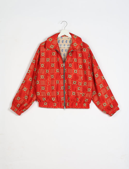 Stylish BOMBER JACKET, an upcycled clothing masterpiece with a cute cropped shape, elasticated details, and detachable metallic zipper. Contrast sari print lining adds a unique touch. Explore sustainable and eco-friendly fashion.