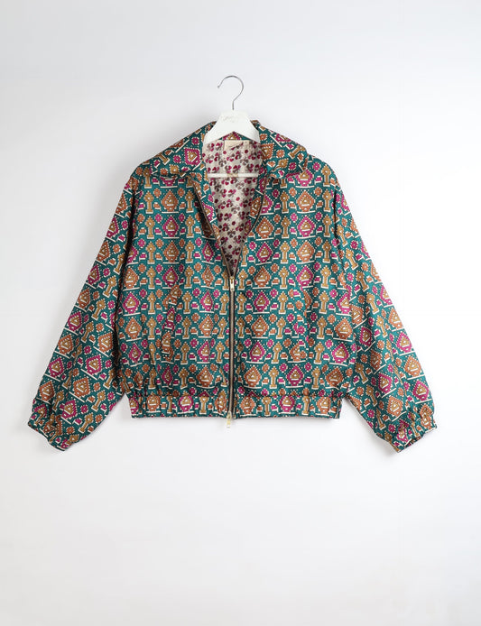 Upcycled Bomber Jacket made from recycled sari materials, featuring a cute cropped shape, elasticated hem and cuffs, and contrast sari print lining. Sustainable apparel promoting eco-friendly fashion and ethical clothing.
