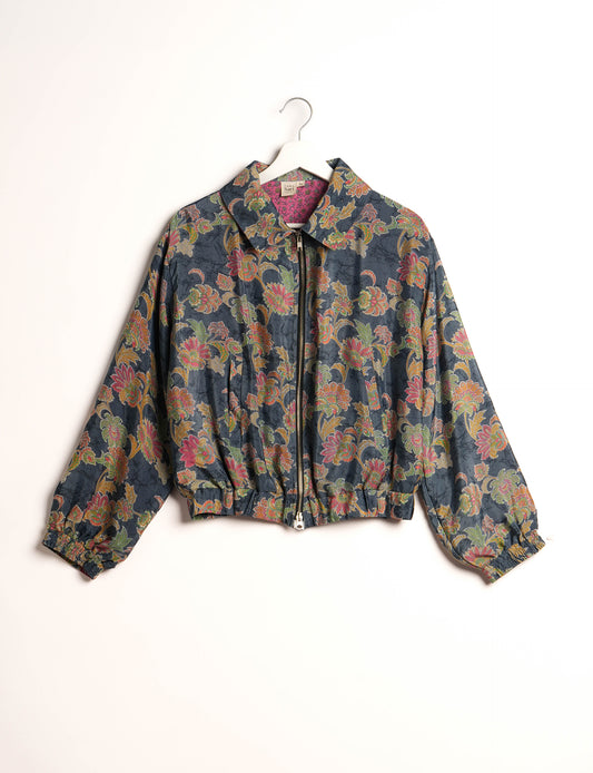 Stylish BOMBER JACKET, an upcycled clothing masterpiece with a cute cropped shape, elasticated details, and detachable metallic zipper. Contrast sari print lining adds a unique touch. Explore sustainable and eco-friendly fashion.