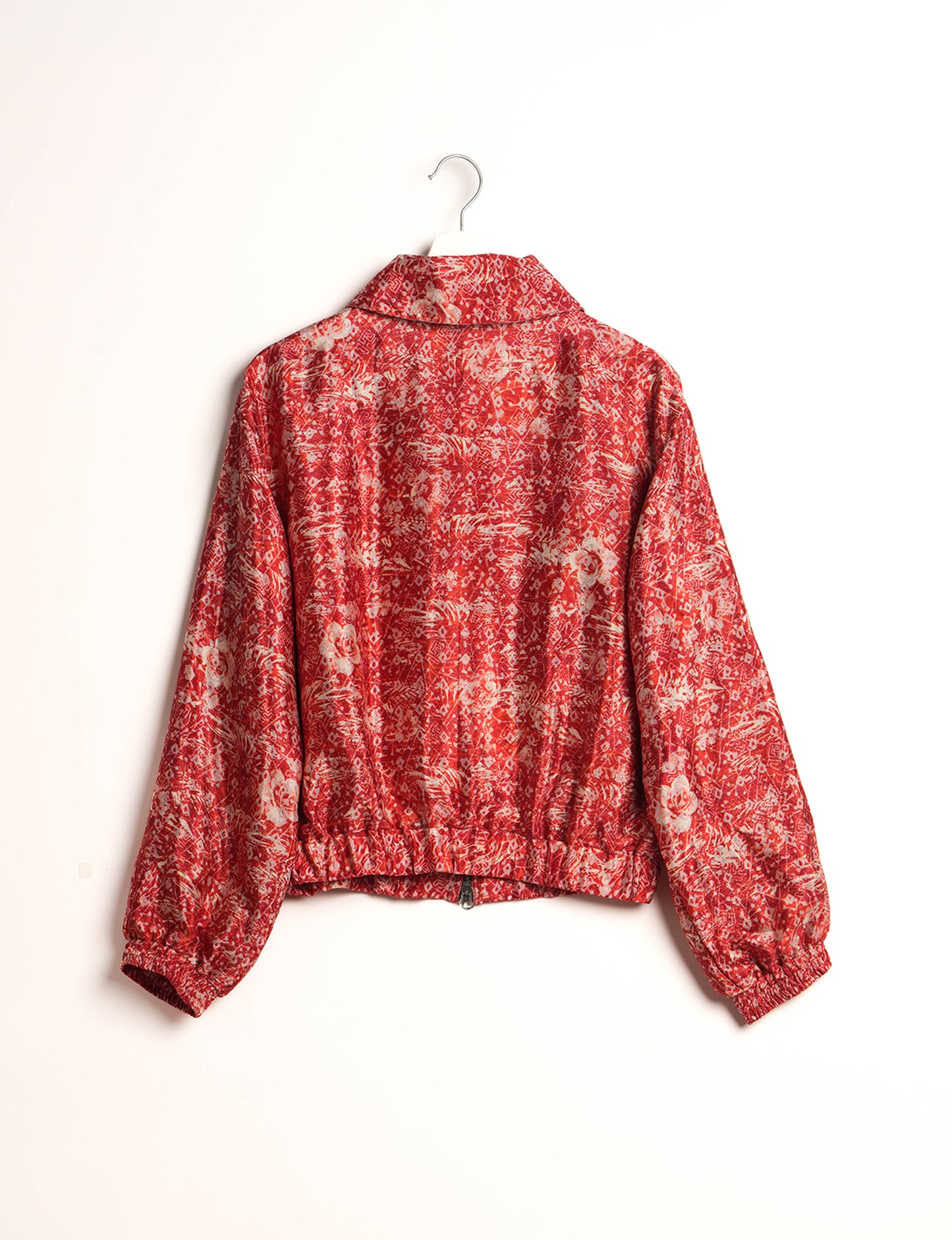 Stylish BOMBER JACKET, an upcycled clothing masterpiece with a cute cropped shape, elasticated details, and detachable metallic zipper. Contrast sari print lining adds a unique touch. Explore sustainable and eco-friendly fashion.