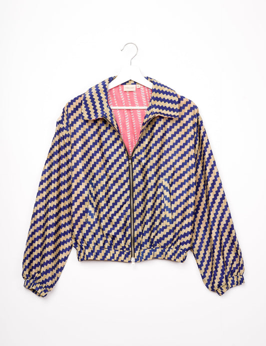 Stylish BOMBER JACKET, an upcycled clothing masterpiece with a cute cropped shape, elasticated details, and detachable metallic zipper. Contrast sari print lining adds a unique touch. Explore sustainable and eco-friendly fashion.