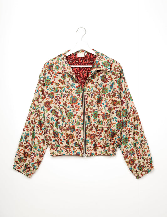 Stylish BOMBER JACKET, an upcycled clothing masterpiece with a cute cropped shape, elasticated details, and detachable metallic zipper. Contrast sari print lining adds a unique touch. Explore sustainable and eco-friendly fashion.