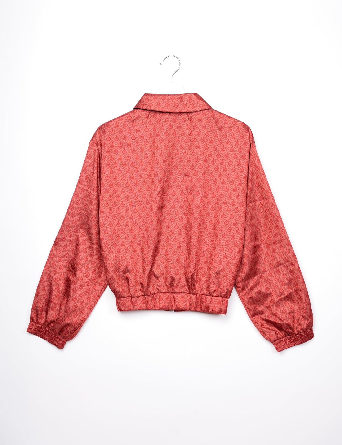 Stylish BOMBER JACKET, an upcycled clothing masterpiece with a cute cropped shape, elasticated details, and detachable metallic zipper. Contrast sari print lining adds a unique touch. Explore sustainable and eco-friendly fashion.