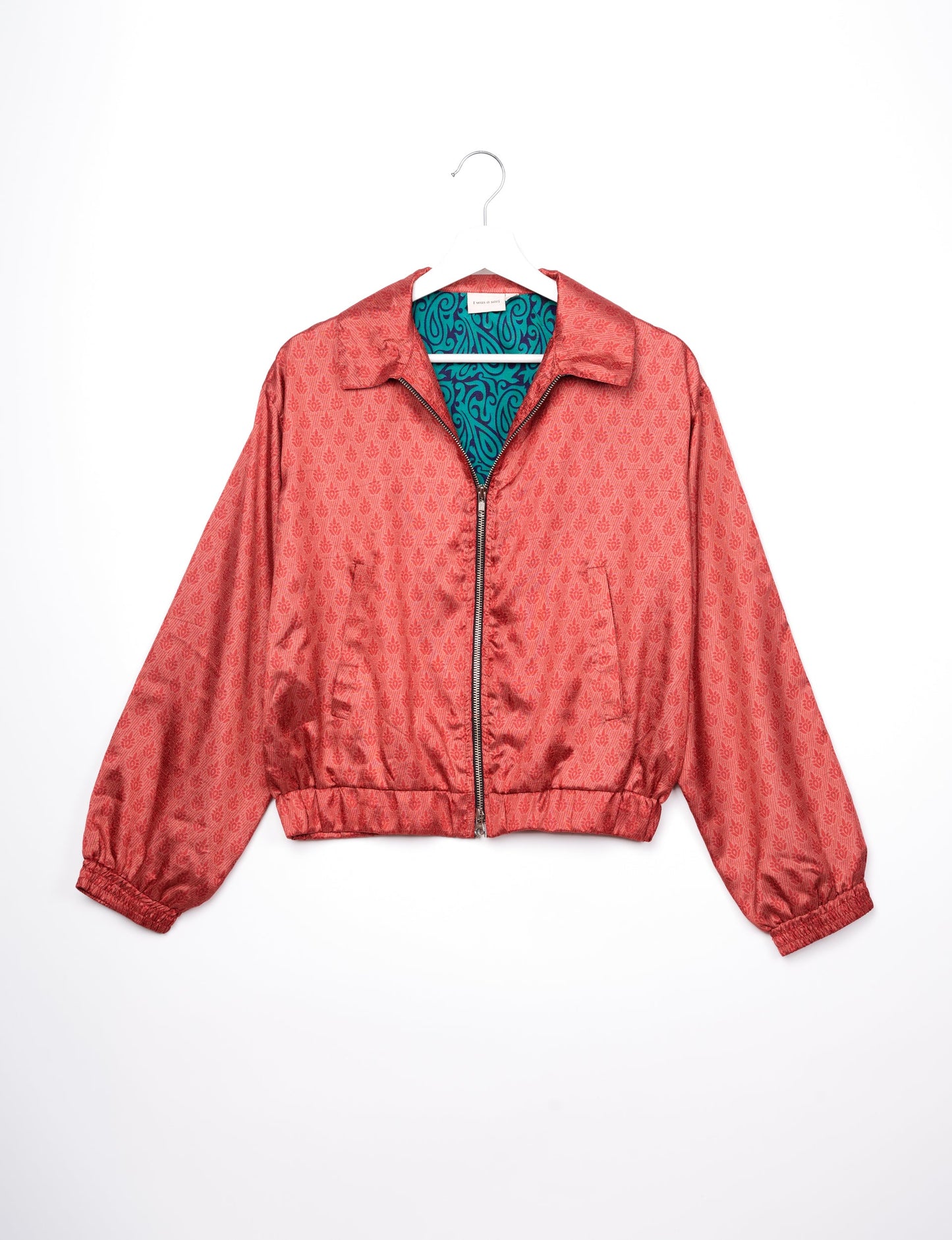 Stylish BOMBER JACKET, an upcycled clothing masterpiece with a cute cropped shape, elasticated details, and detachable metallic zipper. Contrast sari print lining adds a unique touch. Explore sustainable and eco-friendly fashion.