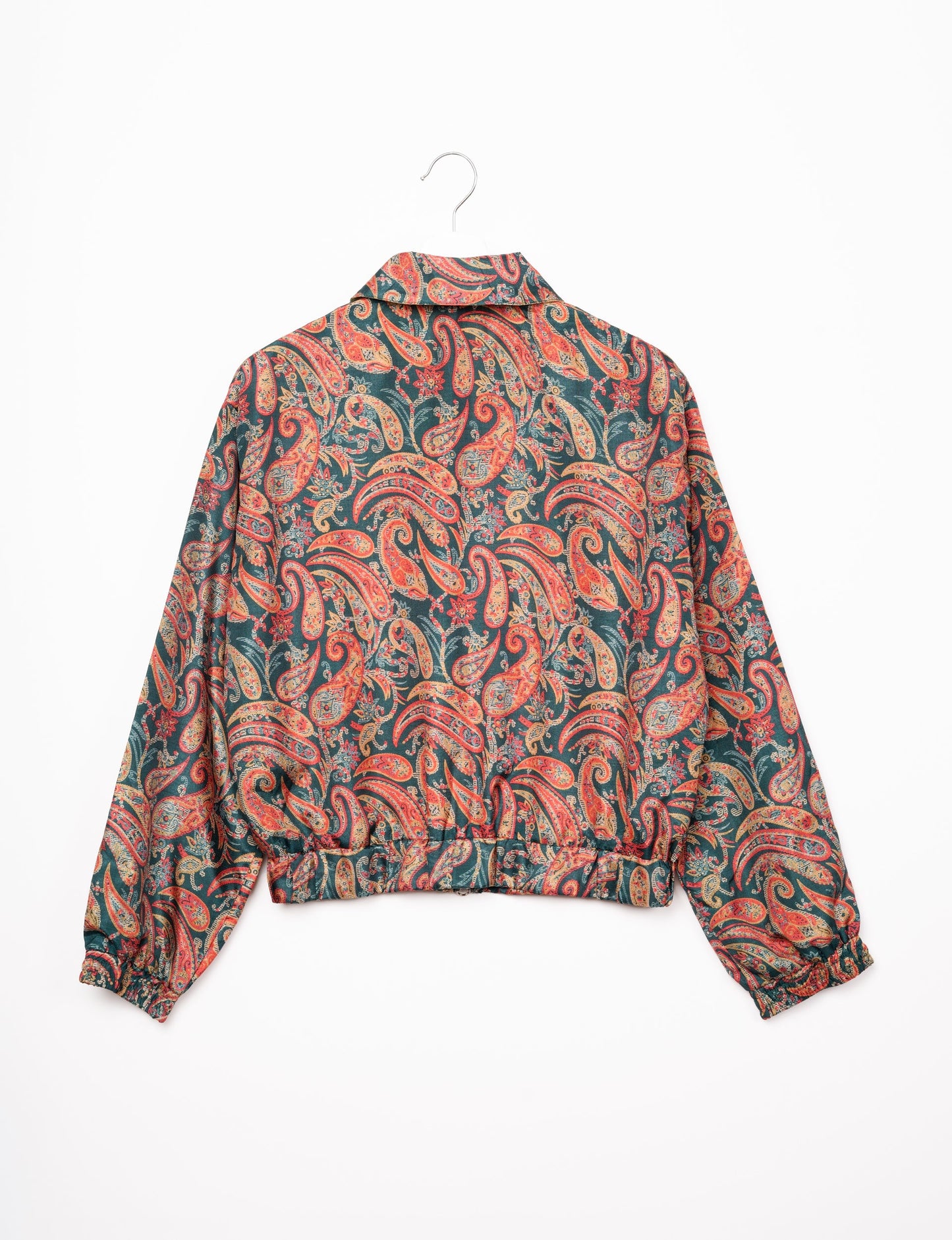 Stylish BOMBER JACKET, an upcycled clothing masterpiece with a cute cropped shape, elasticated details, and detachable metallic zipper. Contrast sari print lining adds a unique touch. Explore sustainable and eco-friendly fashion.