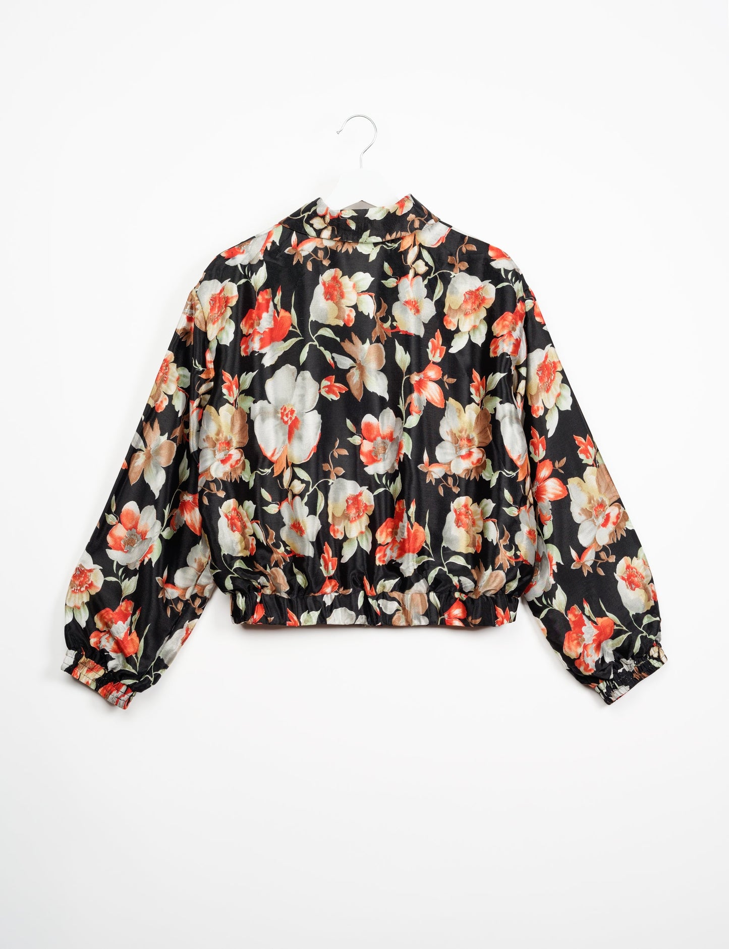 Stylish BOMBER JACKET, an upcycled clothing masterpiece with a cute cropped shape, elasticated details, and detachable metallic zipper. Contrast sari print lining adds a unique touch. Explore sustainable and eco-friendly fashion.