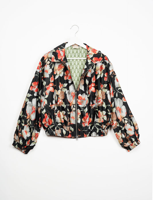 Stylish BOMBER JACKET, an upcycled clothing masterpiece with a cute cropped shape, elasticated details, and detachable metallic zipper. Contrast sari print lining adds a unique touch. Explore sustainable and eco-friendly fashion.