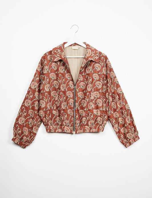 Stylish BOMBER JACKET, an upcycled clothing masterpiece with a cute cropped shape, elasticated details, and detachable metallic zipper. Contrast sari print lining adds a unique touch. Explore sustainable and eco-friendly fashion.