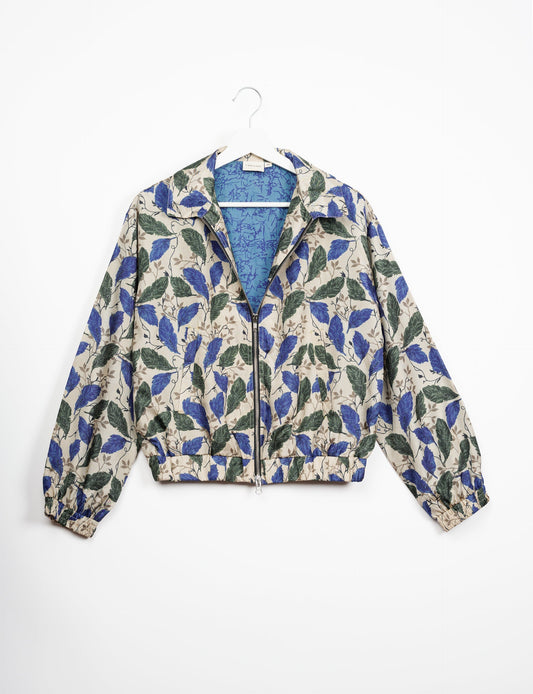 Stylish BOMBER JACKET, an upcycled clothing masterpiece with a cute cropped shape, elasticated details, and detachable metallic zipper. Contrast sari print lining adds a unique touch. Explore sustainable and eco-friendly fashion.