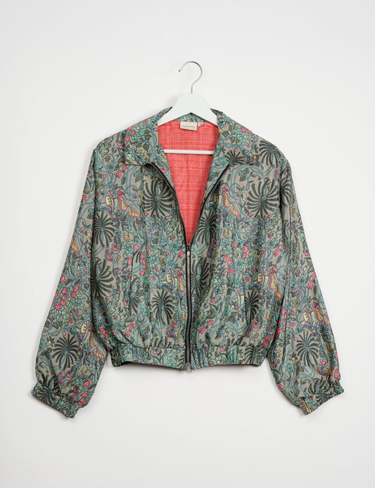 Stylish BOMBER JACKET, an upcycled clothing masterpiece with a cute cropped shape, elasticated details, and detachable metallic zipper. Contrast sari print lining adds a unique touch. Explore sustainable and eco-friendly fashion.