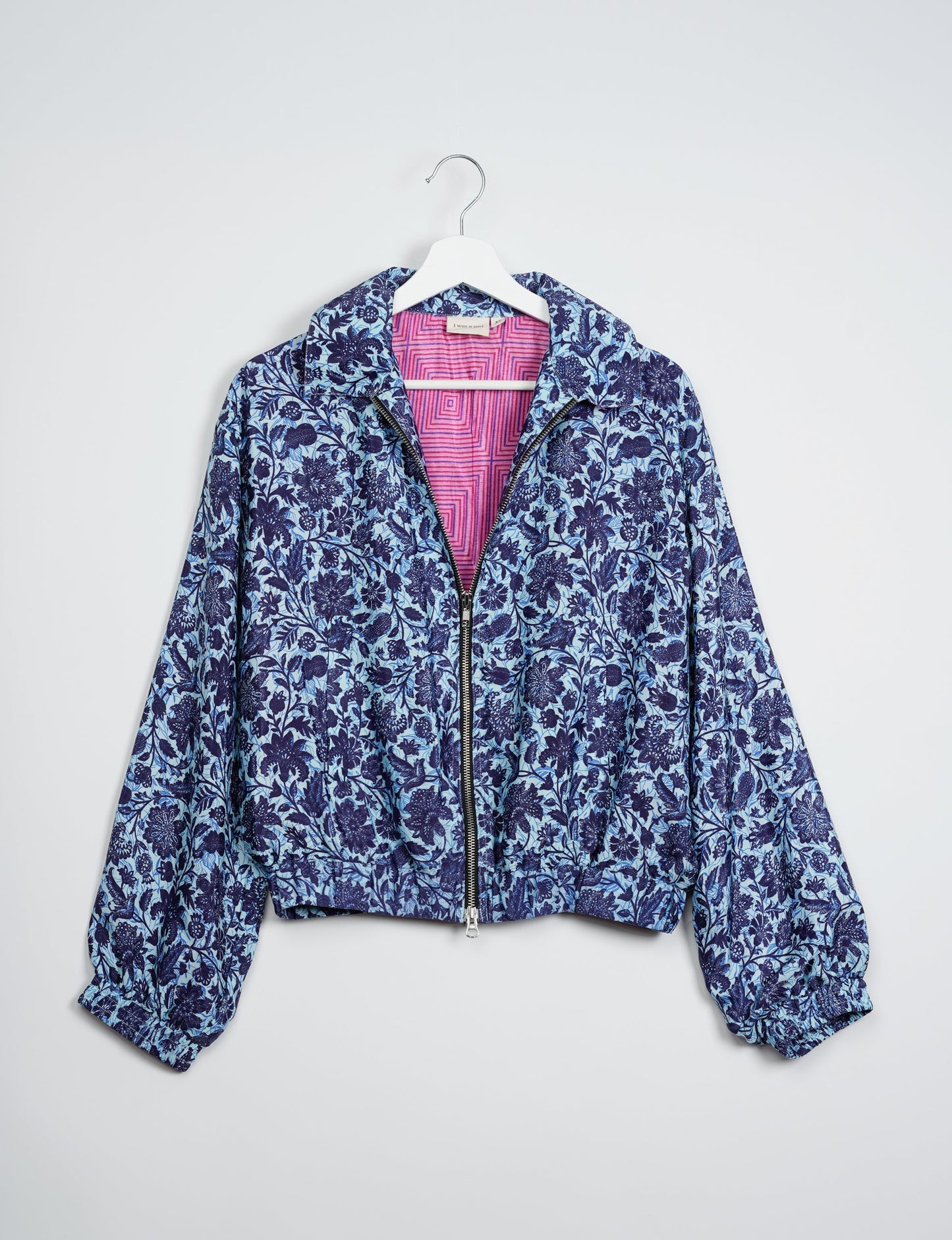 Stylish BOMBER JACKET, an upcycled clothing masterpiece with a cute cropped shape, elasticated details, and detachable metallic zipper. Contrast sari print lining adds a unique touch. Explore sustainable and eco-friendly fashion.