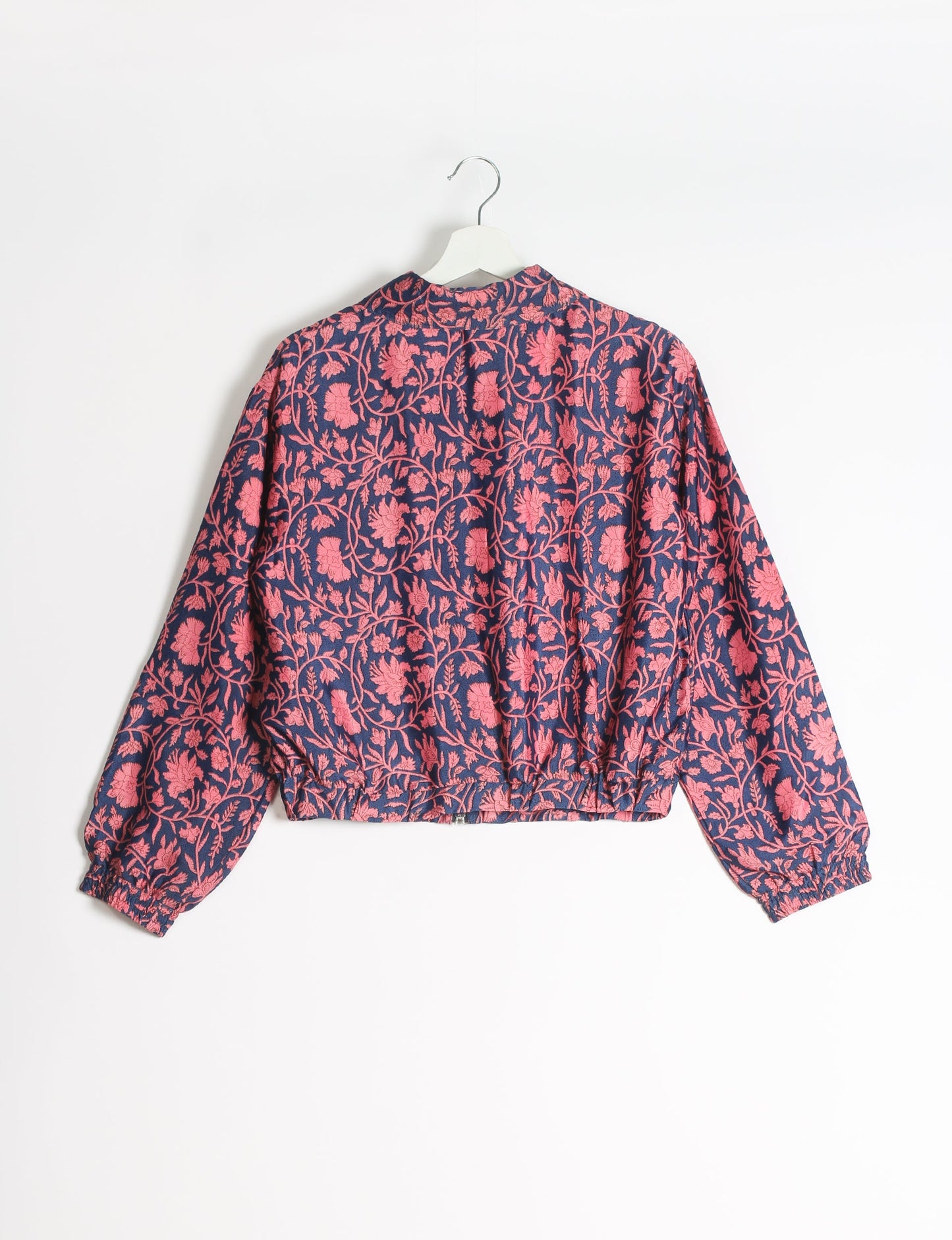 Stylish BOMBER JACKET, an upcycled clothing masterpiece with a cute cropped shape, elasticated details, and detachable metallic zipper. Contrast sari print lining adds a unique touch. Explore sustainable and eco-friendly fashion.