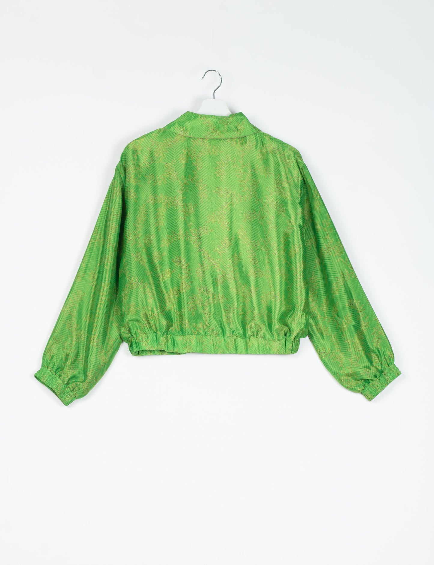 Stylish BOMBER JACKET, an upcycled clothing masterpiece with a cute cropped shape, elasticated details, and detachable metallic zipper. Contrast sari print lining adds a unique touch. Explore sustainable and eco-friendly fashion.