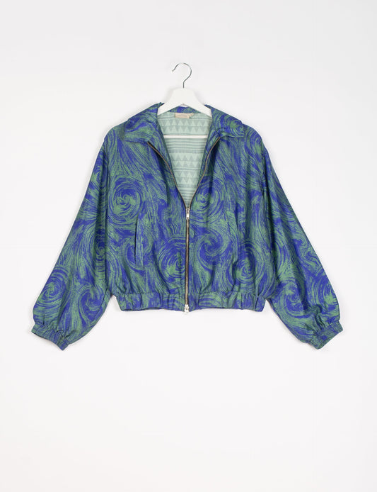 Stylish BOMBER JACKET, an upcycled clothing masterpiece with a cute cropped shape, elasticated details, and detachable metallic zipper. Contrast sari print lining adds a unique touch. Explore sustainable and eco-friendly fashion.