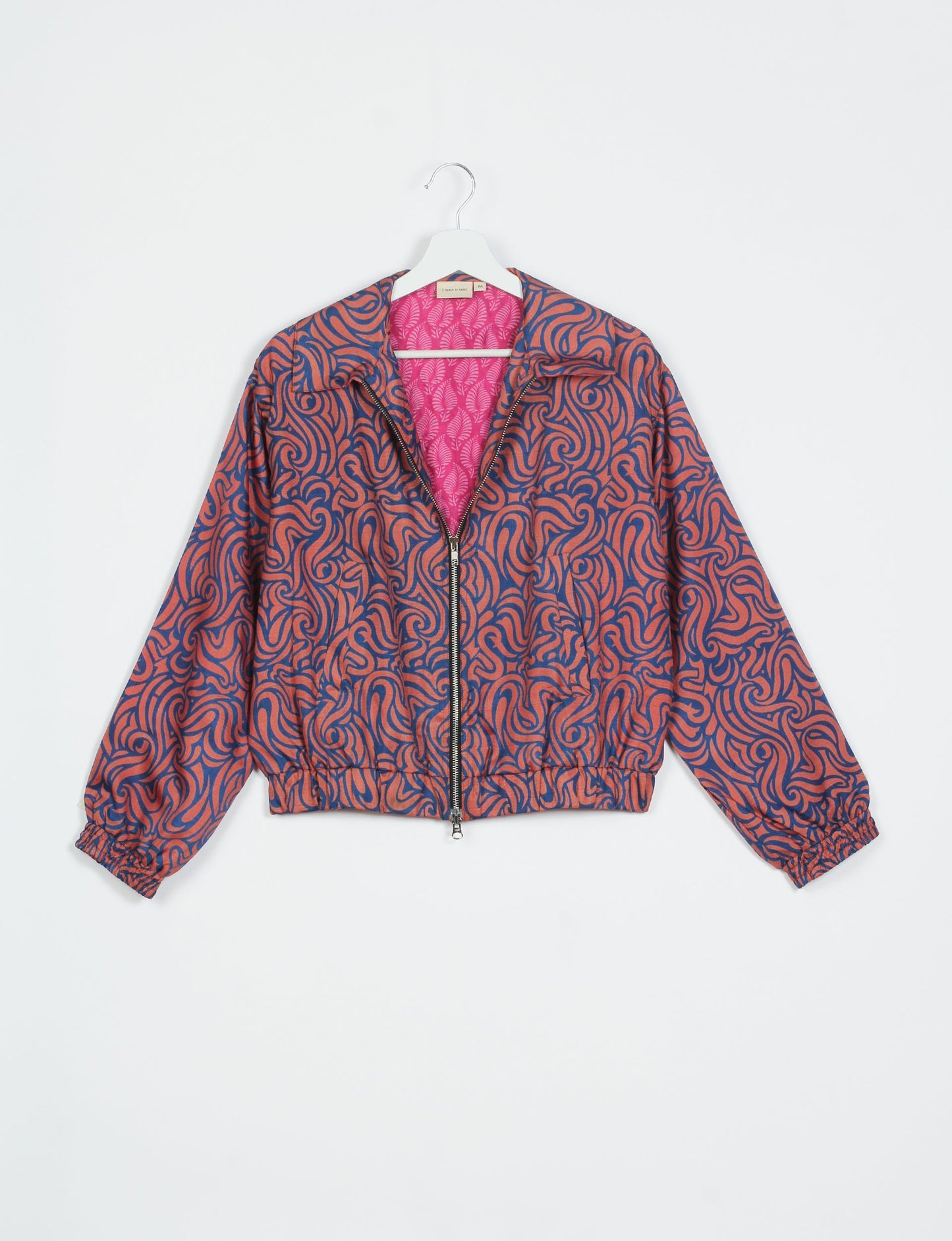 Stylish BOMBER JACKET, an upcycled clothing masterpiece with a cute cropped shape, elasticated details, and detachable metallic zipper. Contrast sari print lining adds a unique touch. Explore sustainable and eco-friendly fashion.