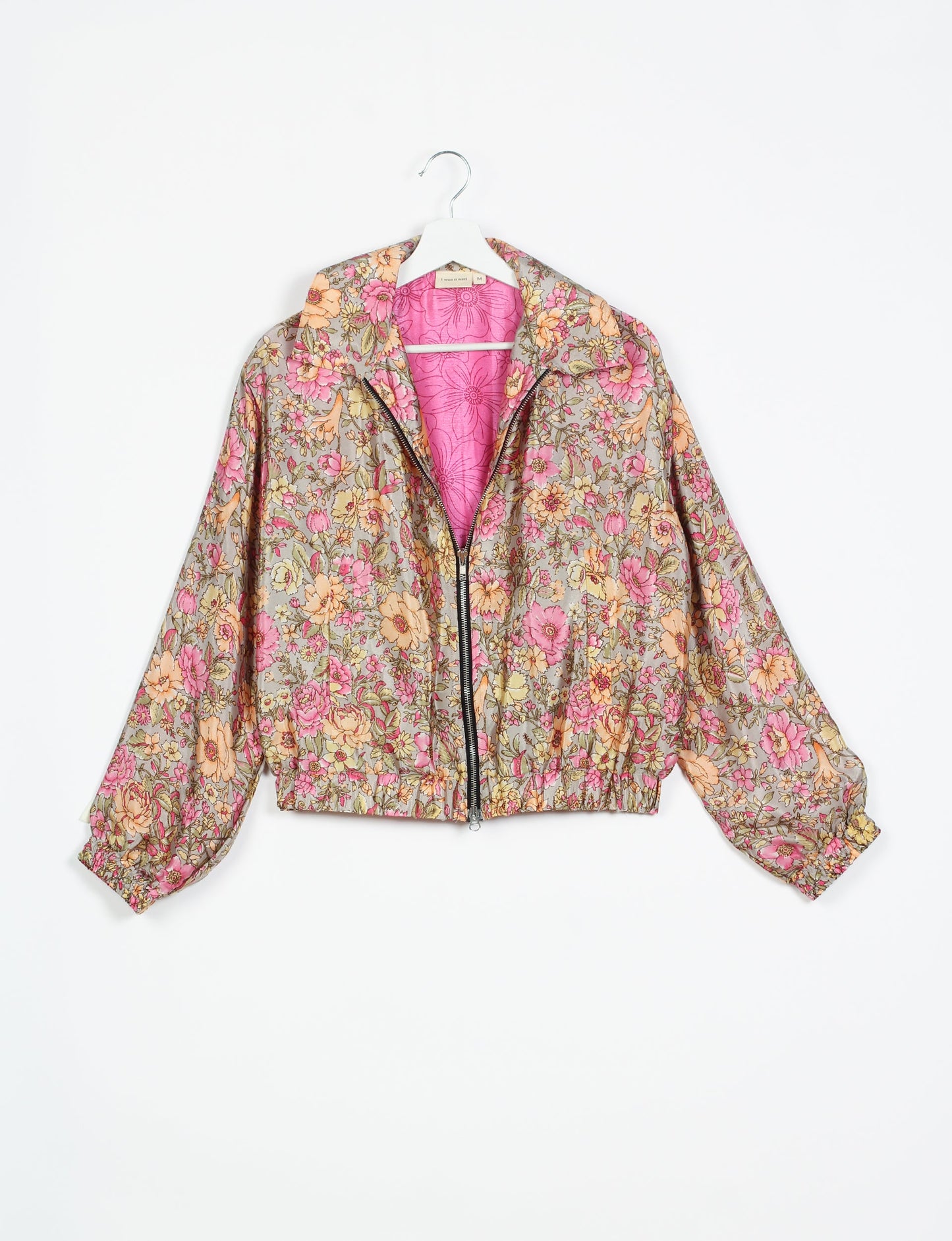 Stylish BOMBER JACKET, an upcycled clothing masterpiece with a cute cropped shape, elasticated details, and detachable metallic zipper. Contrast sari print lining adds a unique touch. Explore sustainable and eco-friendly fashion.