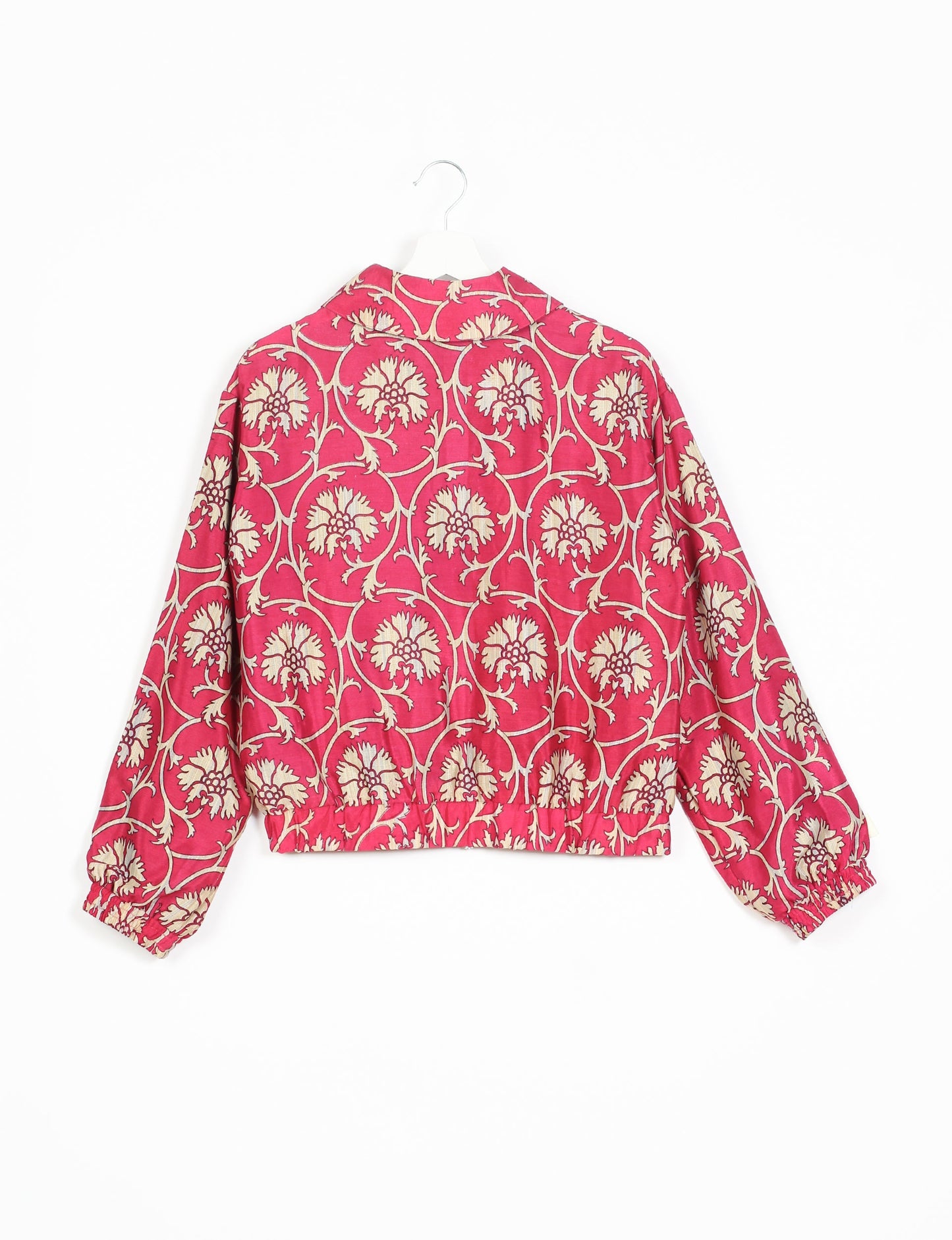 Stylish BOMBER JACKET, an upcycled clothing masterpiece with a cute cropped shape, elasticated details, and detachable metallic zipper. Contrast sari print lining adds a unique touch. Explore sustainable and eco-friendly fashion.