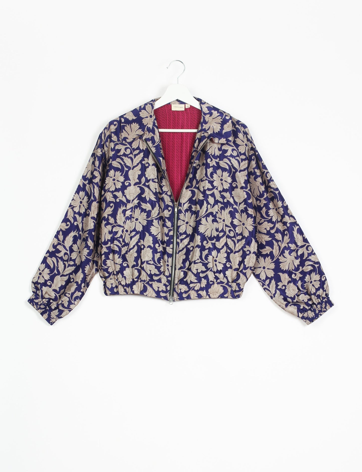 Stylish BOMBER JACKET, an upcycled clothing masterpiece with a cute cropped shape, elasticated details, and detachable metallic zipper. Contrast sari print lining adds a unique touch. Explore sustainable and eco-friendly fashion.