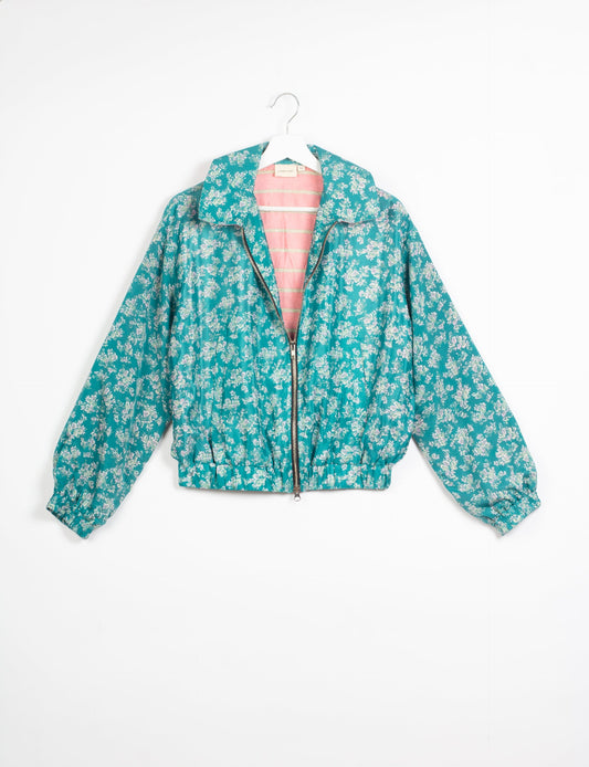 Stylish BOMBER JACKET, an upcycled clothing masterpiece with a cute cropped shape, elasticated details, and detachable metallic zipper. Contrast sari print lining adds a unique touch. Explore sustainable and eco-friendly fashion.