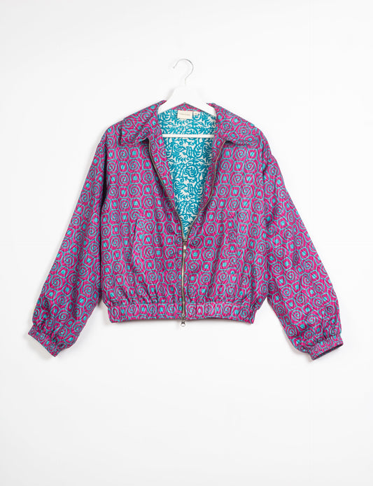 Stylish BOMBER JACKET, an upcycled clothing masterpiece with a cute cropped shape, elasticated details, and detachable metallic zipper. Contrast sari print lining adds a unique touch. Explore sustainable and eco-friendly fashion.