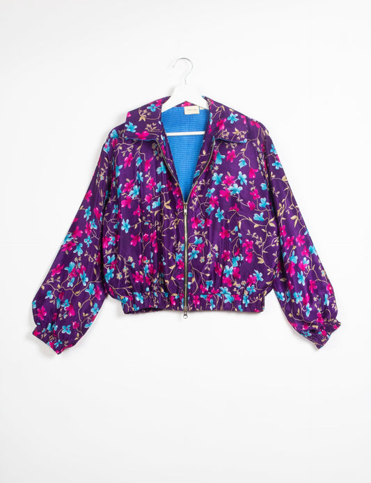 Stylish BOMBER JACKET, an upcycled clothing masterpiece with a cute cropped shape, elasticated details, and detachable metallic zipper. Contrast sari print lining adds a unique touch. Explore sustainable and eco-friendly fashion.