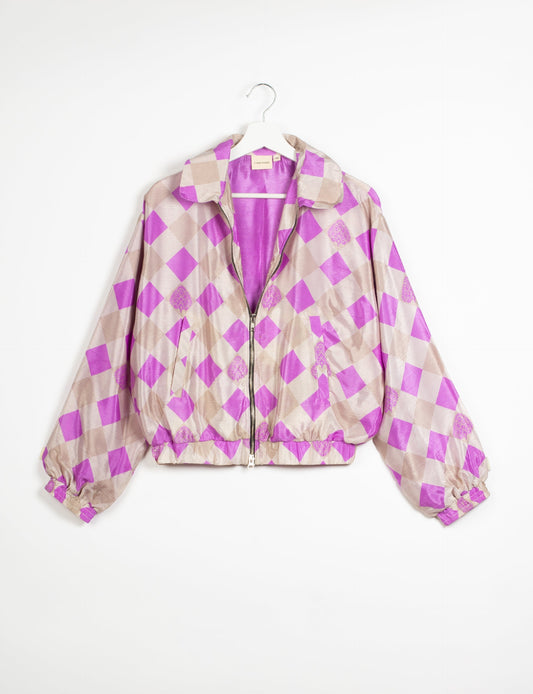 Stylish BOMBER JACKET, an upcycled clothing masterpiece with a cute cropped shape, elasticated details, and detachable metallic zipper. Contrast sari print lining adds a unique touch. Explore sustainable and eco-friendly fashion.