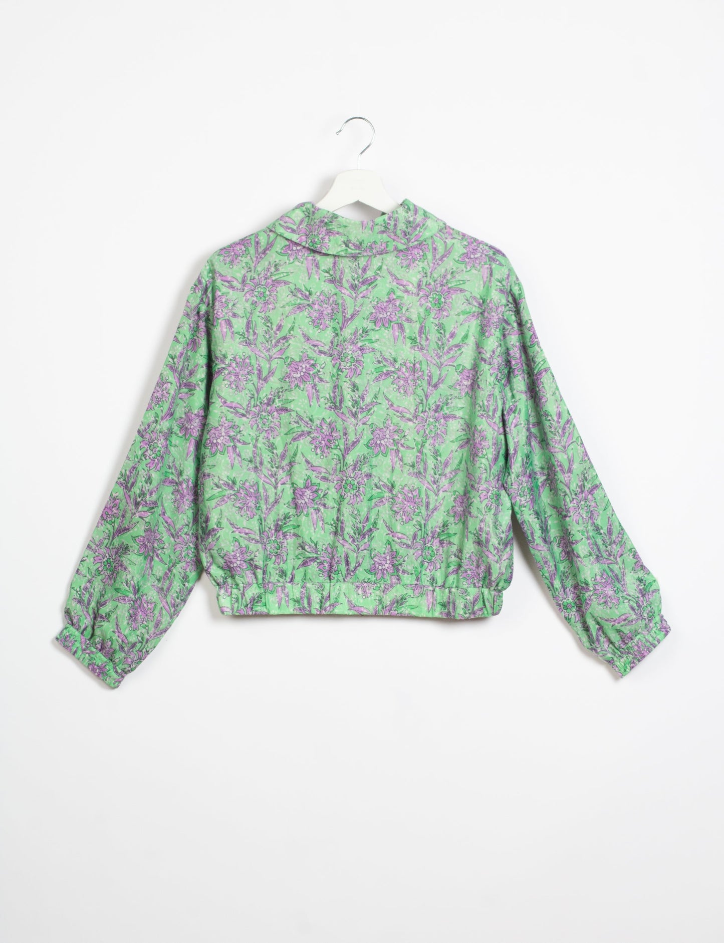 Stylish BOMBER JACKET, an upcycled clothing masterpiece with a cute cropped shape, elasticated details, and detachable metallic zipper. Contrast sari print lining adds a unique touch. Explore sustainable and eco-friendly fashion.