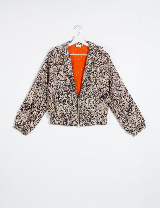 Stylish BOMBER JACKET, an upcycled clothing masterpiece with a cute cropped shape, elasticated details, and detachable metallic zipper. Contrast sari print lining adds a unique touch. Explore sustainable and eco-friendly fashion.