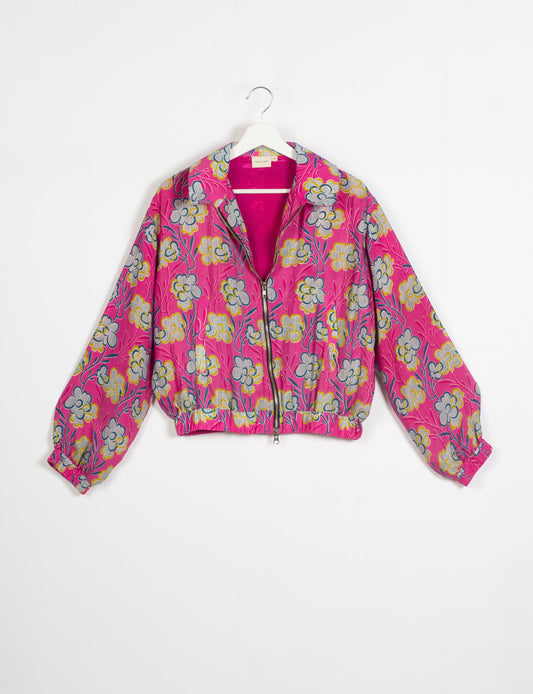 Stylish BOMBER JACKET, an upcycled clothing masterpiece with a cute cropped shape, elasticated details, and detachable metallic zipper. Contrast sari print lining adds a unique touch. Explore sustainable and eco-friendly fashion.