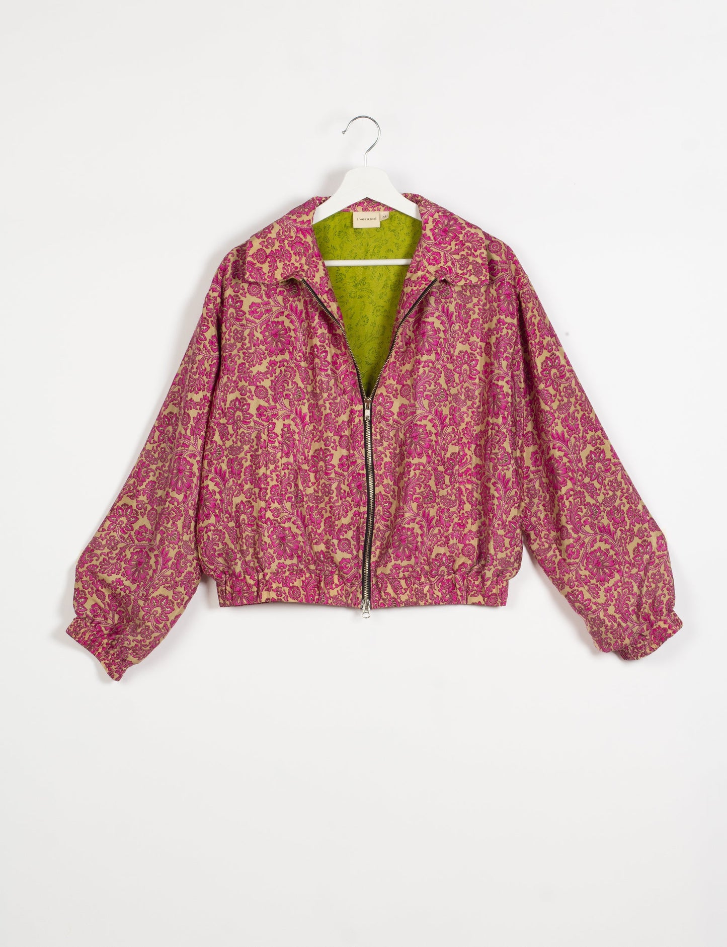 Stylish BOMBER JACKET, an upcycled clothing masterpiece with a cute cropped shape, elasticated details, and detachable metallic zipper. Contrast sari print lining adds a unique touch. Explore sustainable and eco-friendly fashion.