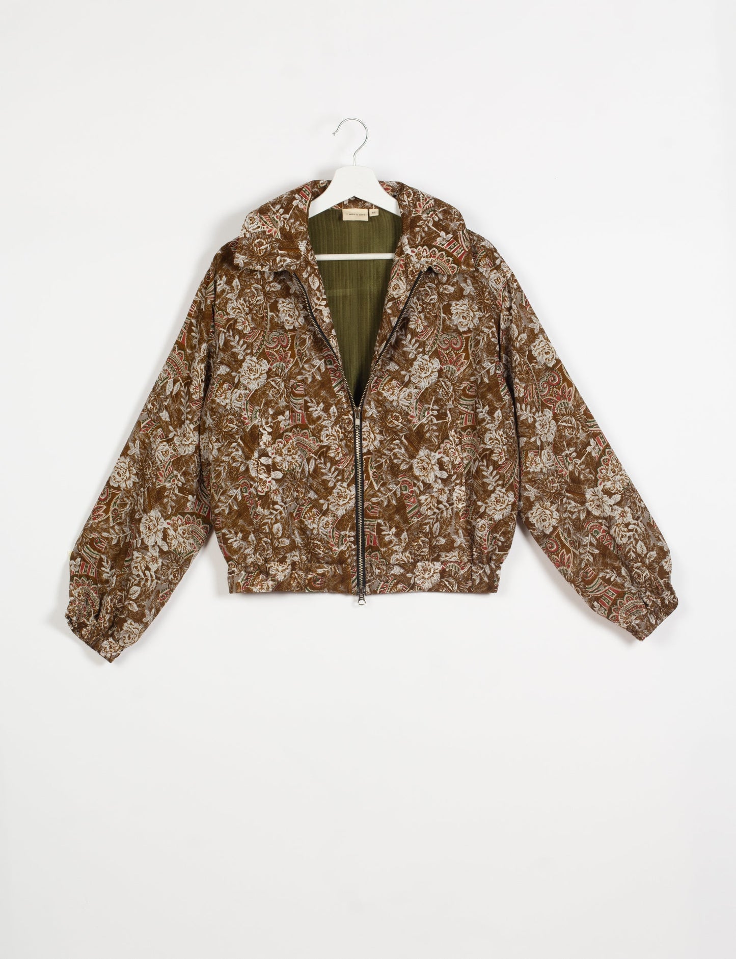 Stylish BOMBER JACKET, an upcycled clothing masterpiece with a cute cropped shape, elasticated details, and detachable metallic zipper. Contrast sari print lining adds a unique touch. Explore sustainable and eco-friendly fashion.