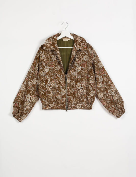 Stylish BOMBER JACKET, an upcycled clothing masterpiece with a cute cropped shape, elasticated details, and detachable metallic zipper. Contrast sari print lining adds a unique touch. Explore sustainable and eco-friendly fashion.