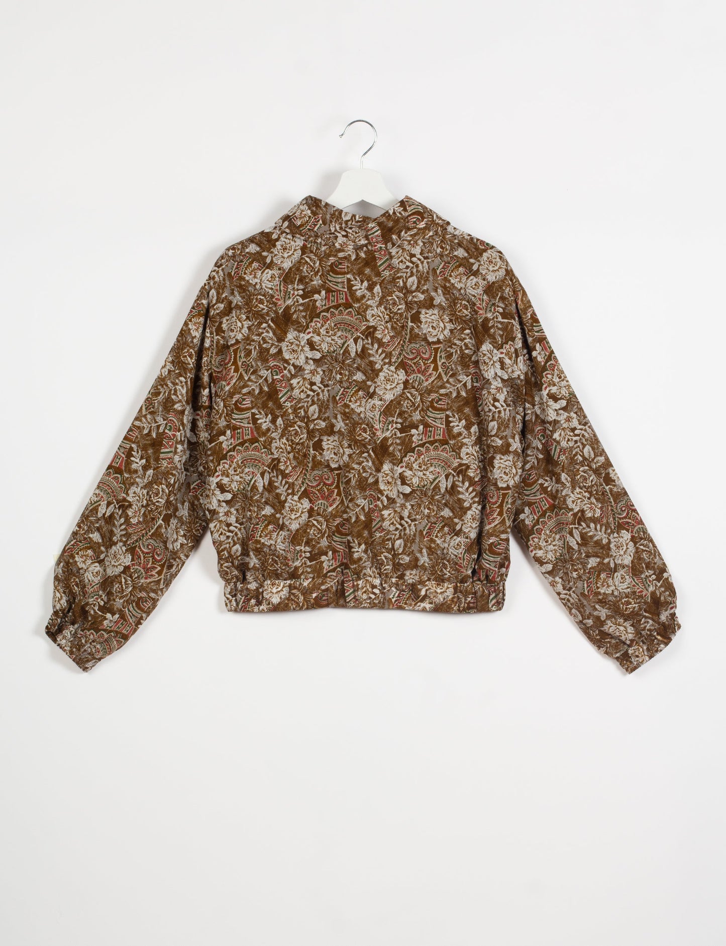 Stylish BOMBER JACKET, an upcycled clothing masterpiece with a cute cropped shape, elasticated details, and detachable metallic zipper. Contrast sari print lining adds a unique touch. Explore sustainable and eco-friendly fashion.