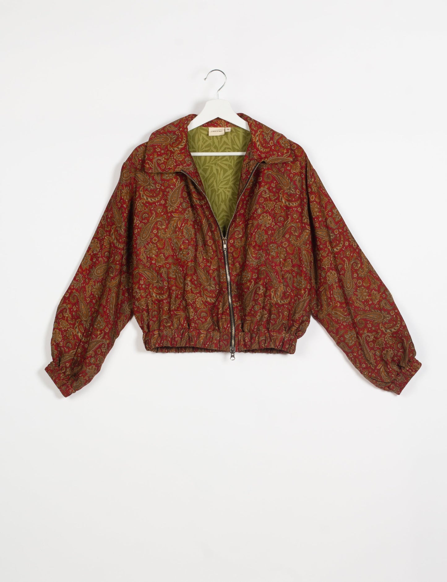 Stylish BOMBER JACKET, an upcycled clothing masterpiece with a cute cropped shape, elasticated details, and detachable metallic zipper. Contrast sari print lining adds a unique touch. Explore sustainable and eco-friendly fashion.