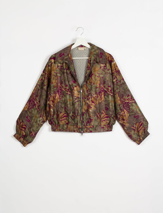 Stylish BOMBER JACKET, an upcycled clothing masterpiece with a cute cropped shape, elasticated details, and detachable metallic zipper. Contrast sari print lining adds a unique touch. Explore sustainable and eco-friendly fashion.