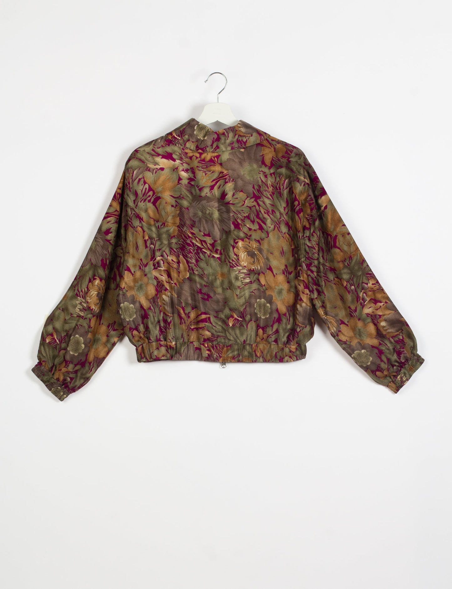 Stylish BOMBER JACKET, an upcycled clothing masterpiece with a cute cropped shape, elasticated details, and detachable metallic zipper. Contrast sari print lining adds a unique touch. Explore sustainable and eco-friendly fashion.