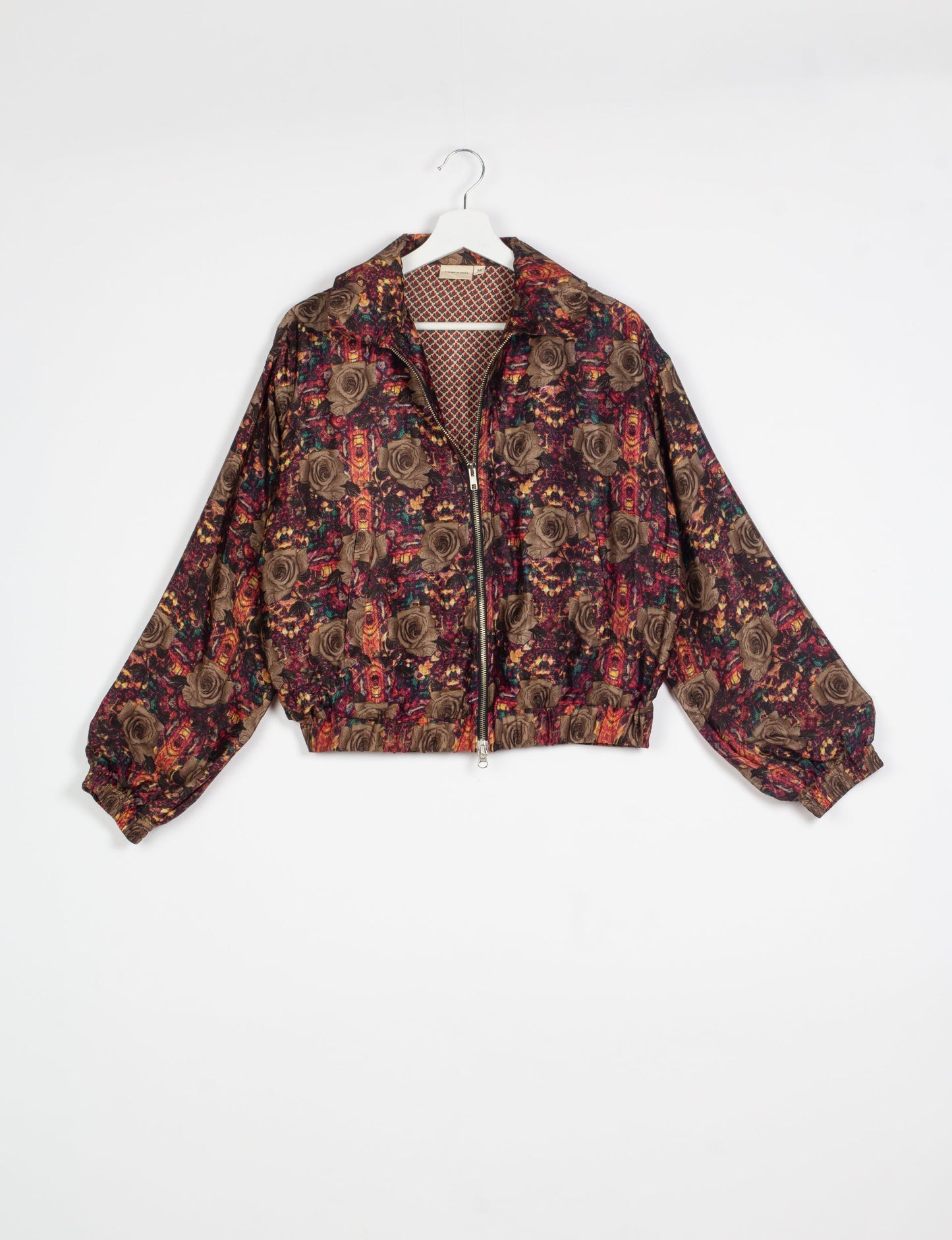 Stylish BOMBER JACKET, an upcycled clothing masterpiece with a cute cropped shape, elasticated details, and detachable metallic zipper. Contrast sari print lining adds a unique touch. Explore sustainable and eco-friendly fashion.